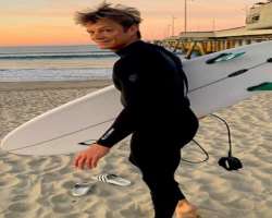 Joel enjoys water surfing when off from work.